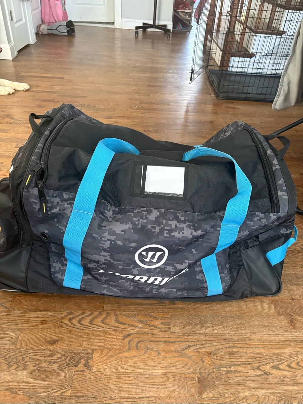 Men's hockey Duffle Bag in Black Digital Camo with Blue Accents wheeled